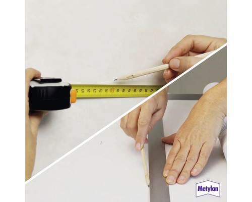 Zwei Hände messen und markieren mit einem Rollbandmaß, einem Bleistift und einem Lineal