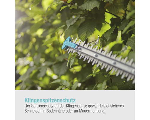 Heckenschere mit Klingenspitzenschutz beim Schneiden einer Hecke