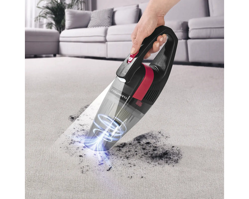 Handstaubsauger im Einsatz auf einem Teppich.