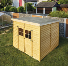 Abri de jardin en bois avec toit plat et double porte dans le jardin