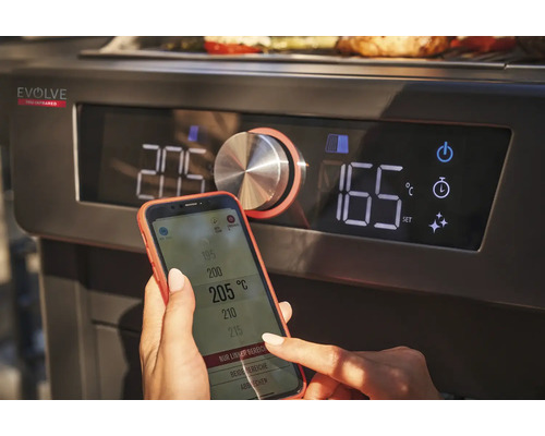 Gros plan d''un barbecue avec affichage numérique, commandé via un smartphone.