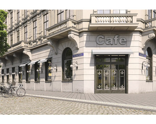 Aussenansicht eines Cafés in einem Gebäude mit Markisen und Fahrrädern
