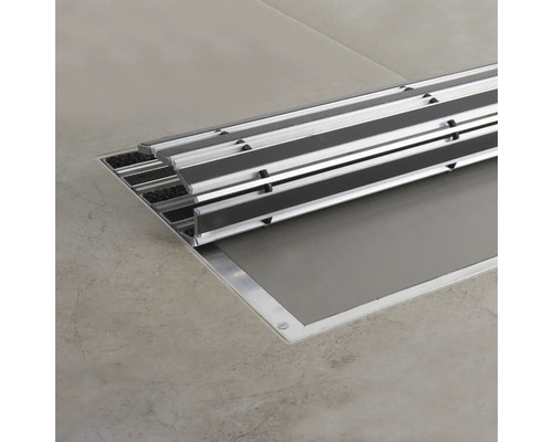 Tapis de propreté encastré en aluminium et textile sur sol carrelé