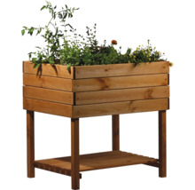 Jardinière sur pieds en bois avec des plantations
