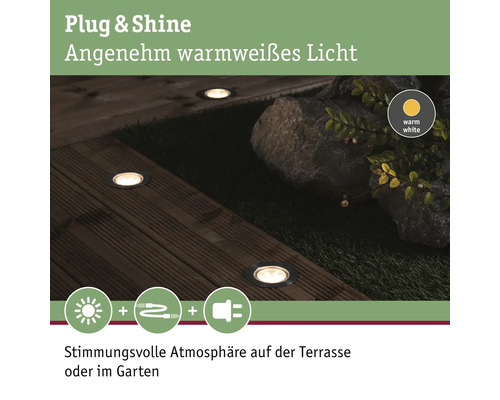 Image d''ambiance de spots de sol Plug and Shine sur une terrasse en bois et dans le jardin