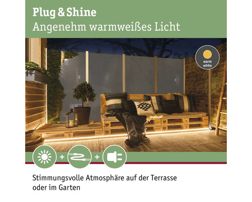 Terrasse avec mobilier de palettes et éclairage blanc chaud pour une ambiance chaleureuse
