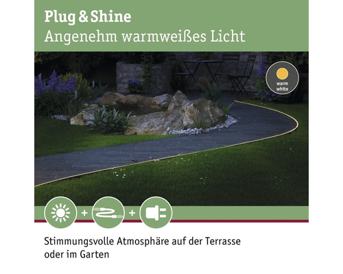 Chemin de jardin éclairé avec le système d''éclairage Plug and Shine pour une ambiance chaleureuse.