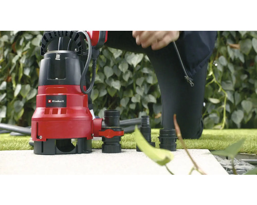 Einhell Schmutzwasserpumpe mit Zubehör auf Steinfläche