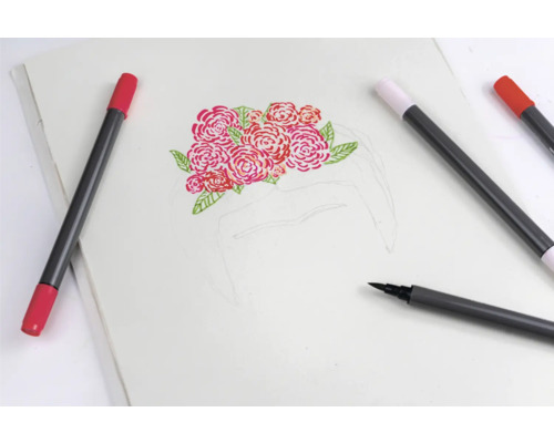Skizzenblock mit Rosenmotiv und Stiften