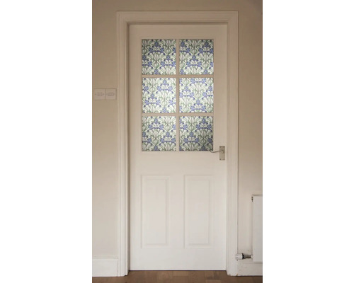 Porte blanche avec décoration en verre à motifs floraux.