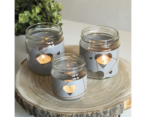 Bougeoirs décoratifs en verre avec motif de cœur sur une rondelle de bois