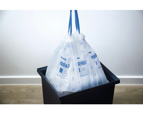 Müllbeutel mit Zugband im Mülleimer