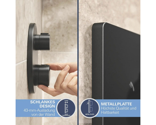 Gros plan d''un mitigeur thermostatique noir fin avec plaque métallique dans la salle de bains