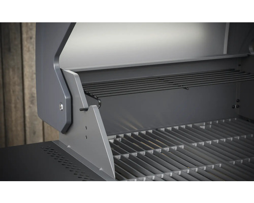 Innenansicht eines Gasgrills mit Grillrost und Warmhalterost.