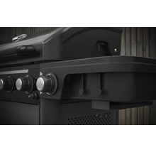 Gros plan d''un barbecue à gaz noir avec des boutons rotatifs pour régler la chaleur