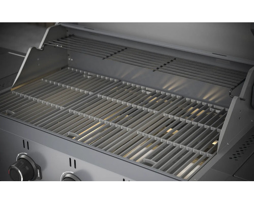 Innenansicht eines Grills mit Grillrost und Warmhalterost