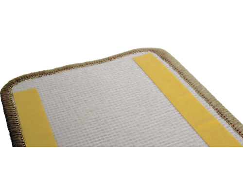 Vue détaillée d'une sous-couche de tapis avec des bandes adhésives