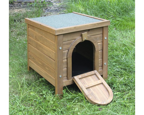 Maison en bois pour petits animaux avec porte dans le jardin