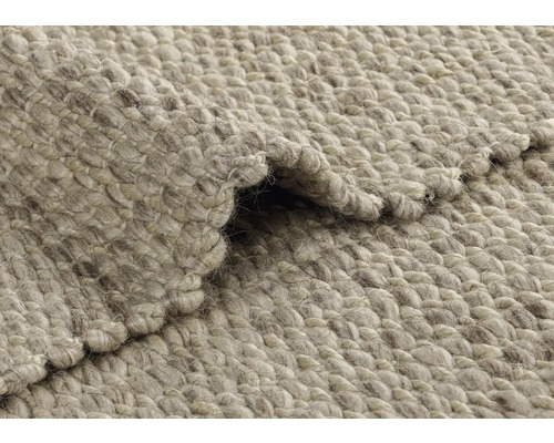 Gros plan d''un tapis en fibres naturelles plié