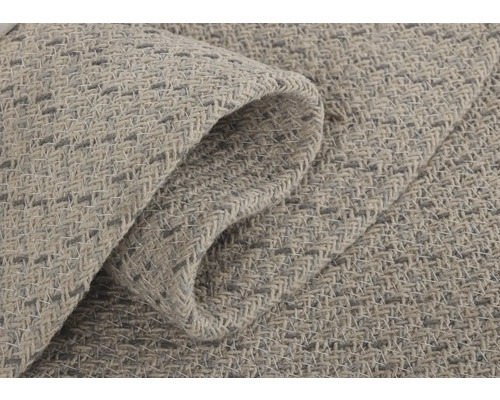 Gros plan d''un tapis de couleur claire avec une texture tissée