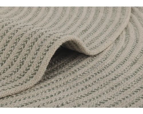 Gros plan d''un tapis rond avec un motif tressé