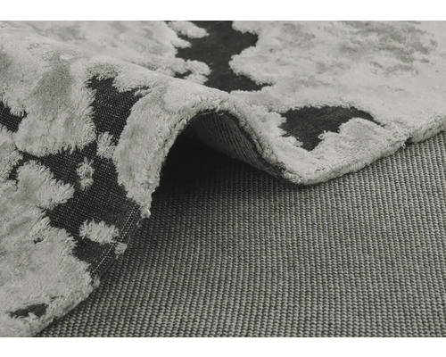 Tapis gris avec motif abstrait