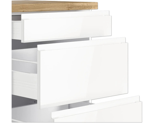 Gros plan d''un meuble de salle de bains blanc avec tiroirs et plateau en bois