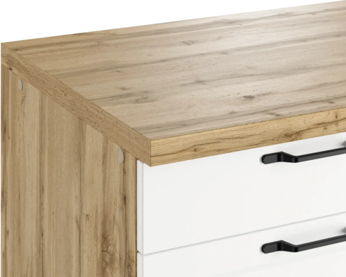 Vue détaillée d''un élément de commode avec surface en bois et tiroirs blancs avec poignées