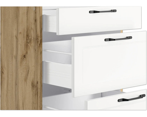 Küchenschrank mit weißen Schubladen und schwarzen Griffen