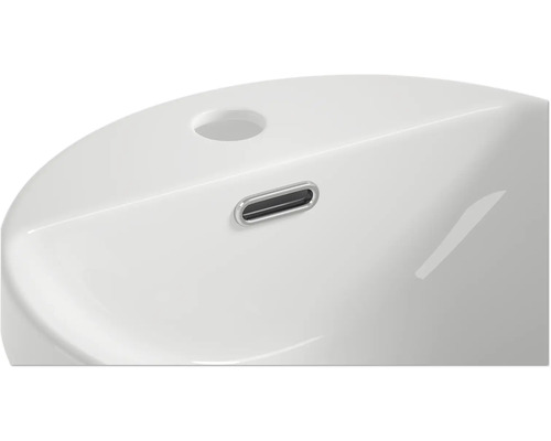 Detailansicht eines Waschbeckens mit Überlauf