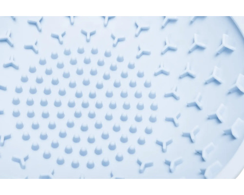 Gros plan d''un tapis de douche avec picots et éléments triangulaires
