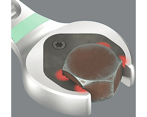 Une clé à fourche agrippe une vis.