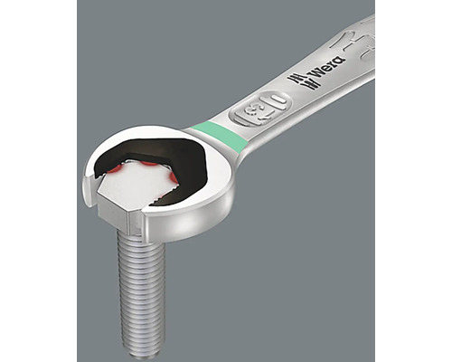 Une clé à fourche de la marque Wera serre une vis.