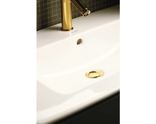 Image d''un lavabo avec robinet et bonde de couleur or