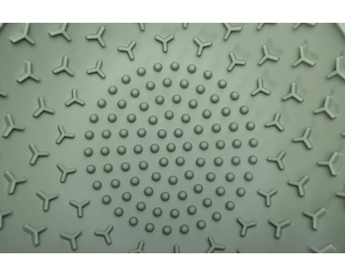 Detailansicht einer runden Duschmatte mit Noppen und dreieckigen Elementen