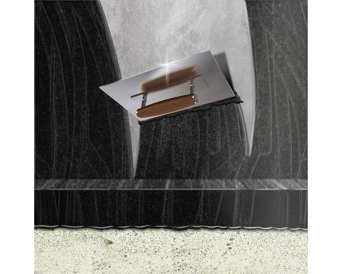 Taloche pour appliquer du plâtre sur une surface foncée