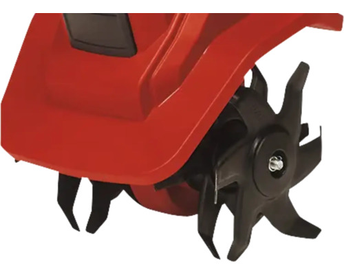 Detailansicht einer Gartenfräse mit rotierenden Messern zur Bodenbearbeitung.