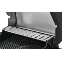 Gros plan d''une grille de barbecue avec une grille de maintien au chaud