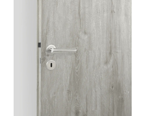 Porte en bois grise avec poignée de porte et trou de serrure argentés