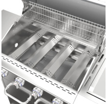 Vue intérieure d''un gril à gaz avec grille de cuisson et brûleurs en acier inoxydable