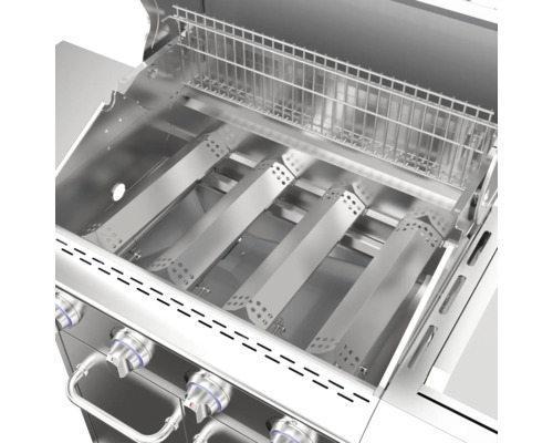 Vue intérieure d''un gril à gaz avec grille de cuisson et brûleurs en acier inoxydable