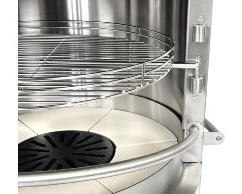 Vue intérieure d''un barbecue avec grille et pierre à pizza