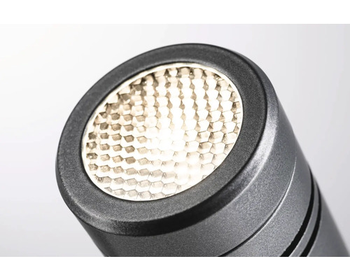 Gros plan d''une lampe noire avec un motif en nid d''abeilles
