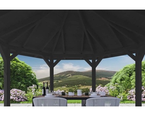 Scène dans un pavillon de jardin avec une table dressée et vue sur la nature