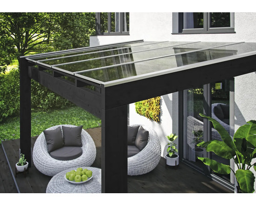 Pergola de terrasse avec toit en verre et coin salon dans le jardin