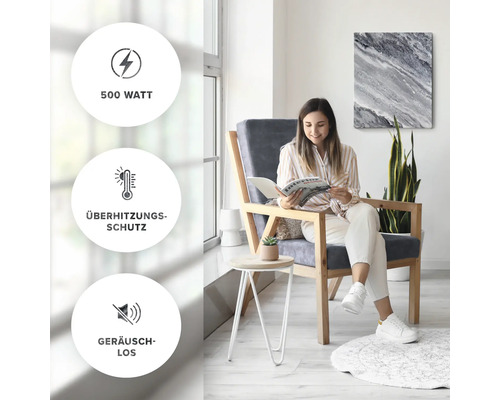 Une femme lit dans une pièce lumineuse. Les symboles 500 watts, protection contre la surchauffe et silencieux sont visibles.