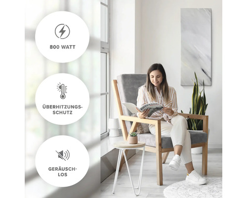 Femme lisant dans une pièce lumineuse. Caractéristiques du produit : 800 watts, protection contre la surchauffe, silencieux