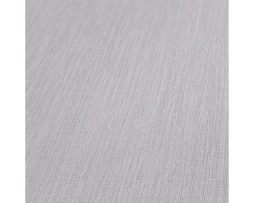 Nahaufnahme einer strukturierten, hellen Tapete.