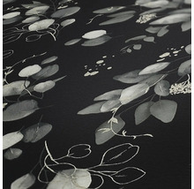 Gros plan d''une surface sombre avec motif de feuilles