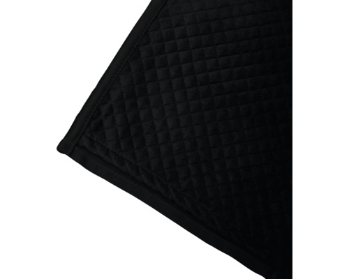 Détail d''une couverture sombre matelassée avec un motif carré